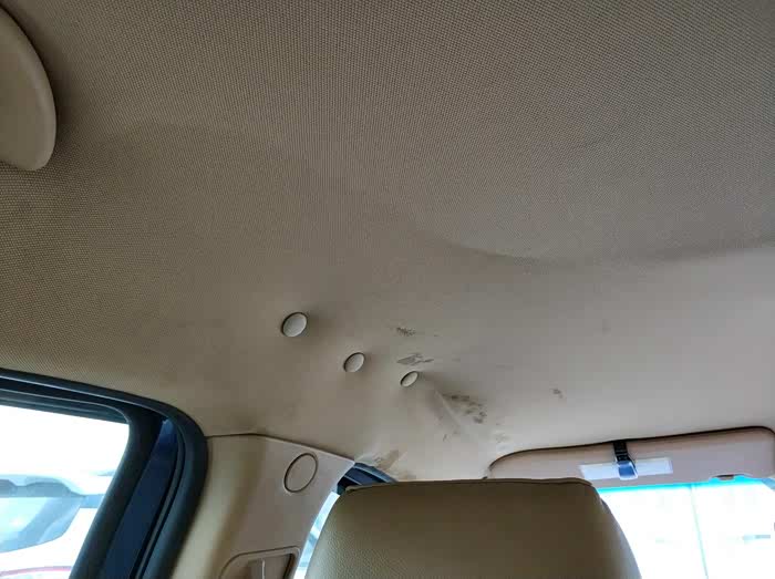 顶棚脱落,换总成还是去贴新布?